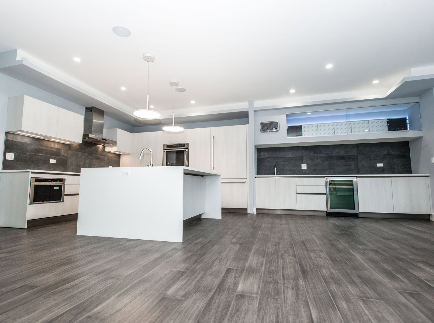 Kitchen with gray wood floors 